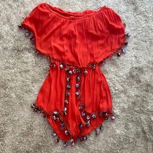Surf gypsy coral romper with pom-poms
